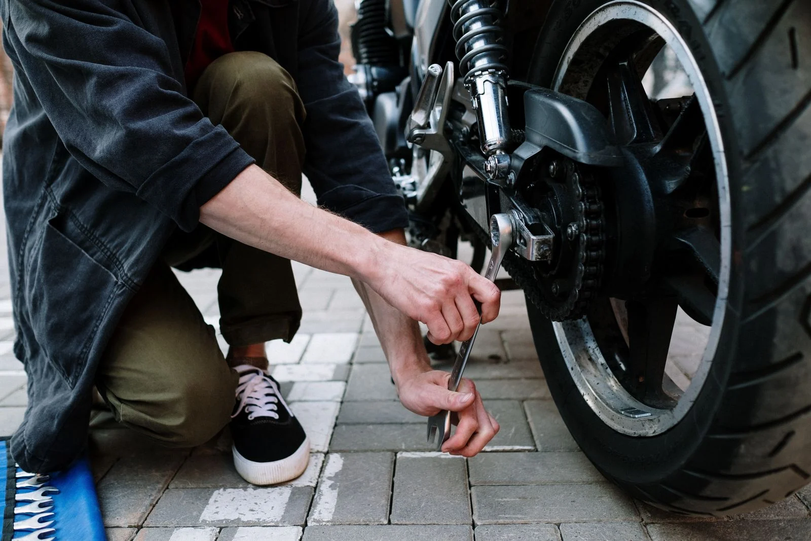 Spanner on a motorcycle rear wheel and chain
