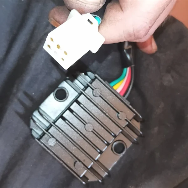 GY6 5-wire regulator rectifier VOLT-002 with its 5-pin plug, photographed at Bike Sense